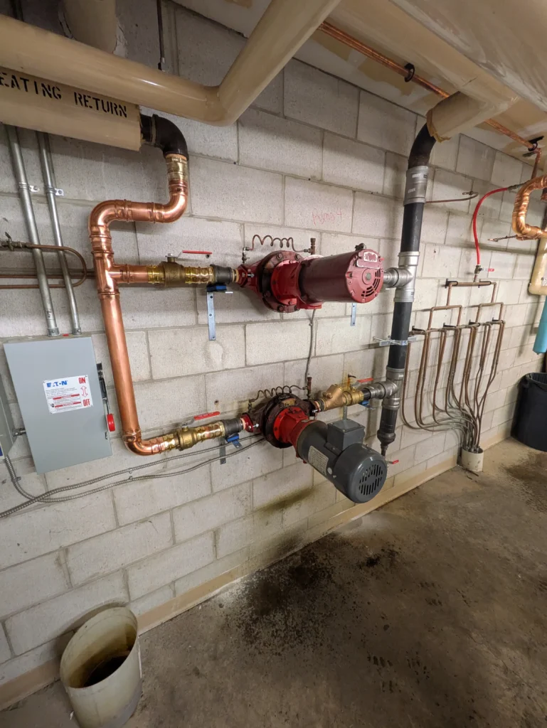 Hydronic heating piping with circulator pumps and valves